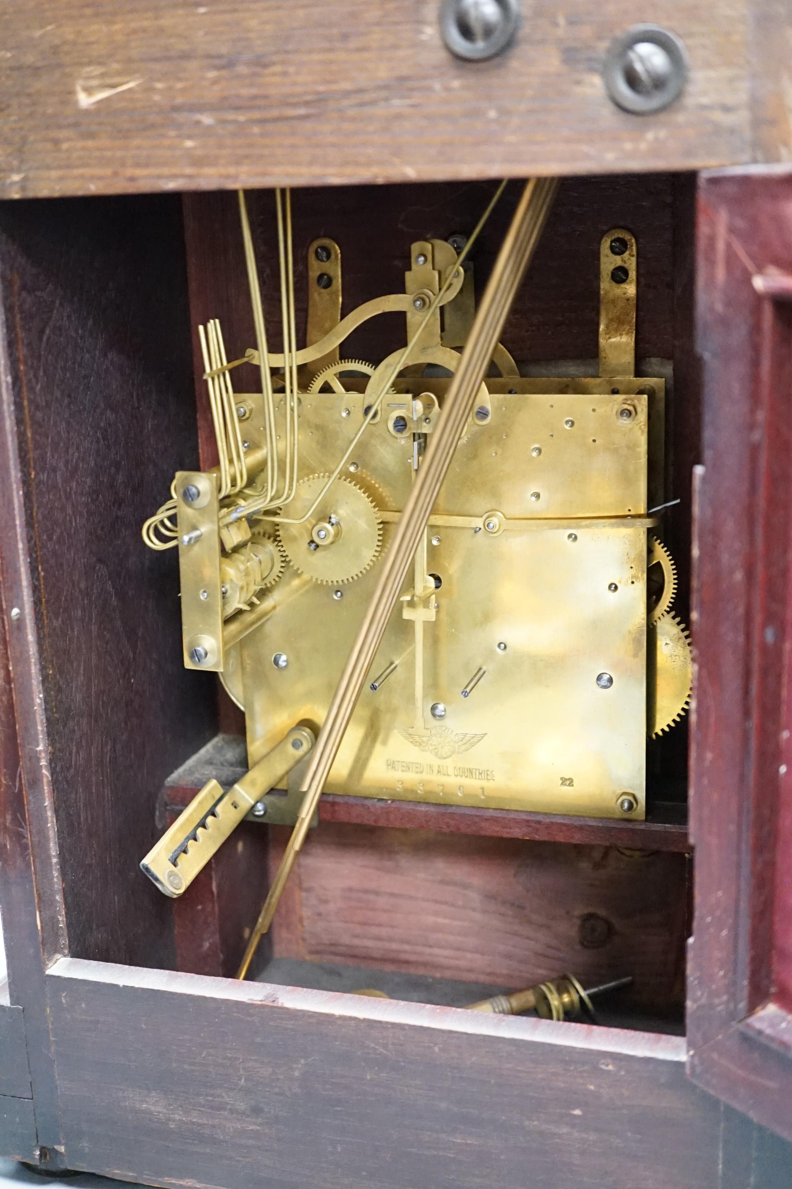 An early 20th century German walnut and marquetry chiming mantel clock, 42cms high